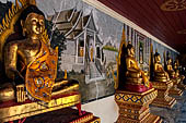 Chiang Mai - Wat Phra That Doi Suthep. The walls of the gallery are covered with Buddha statues and mural paintings of Jataka and tales of the previous lives of the Buddha.